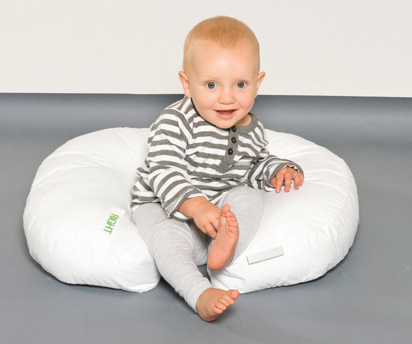 baby sitting up using inspired mother feeding and support pillow