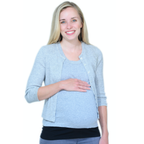 A smiling pregnant woman wearing a light grey top, over a black tummy band and blue jeans, standing against a solid white background.
