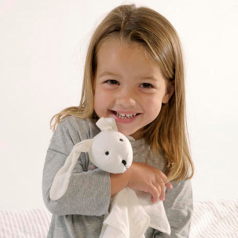 Child holding a my luvvie bunny in white organic cotton 